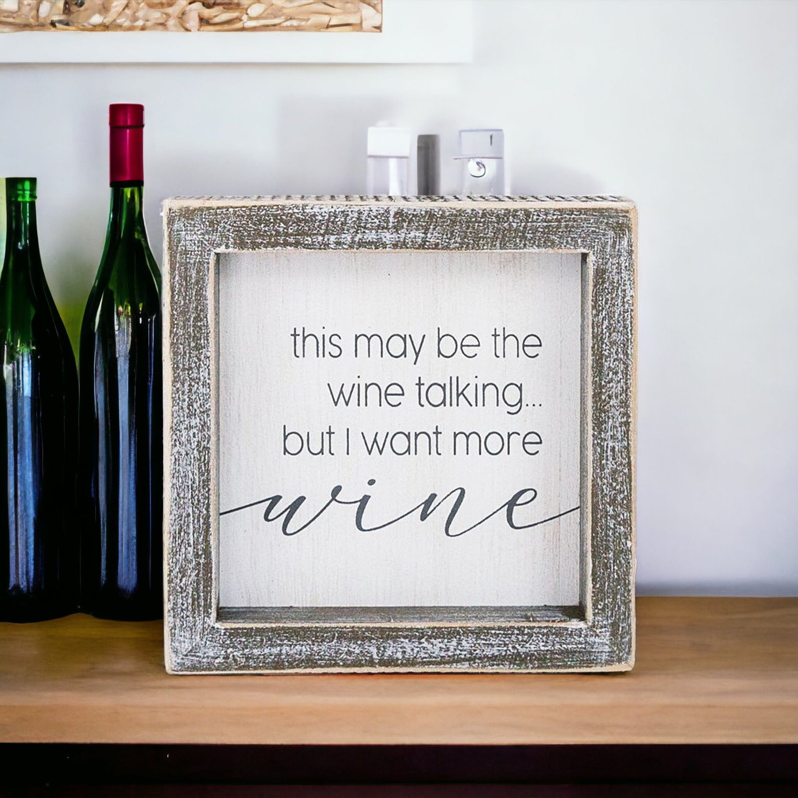 A decorative piece featuring a witty quote about wine, perfect for wine lovers, measuring 5x5x1.5 inches.