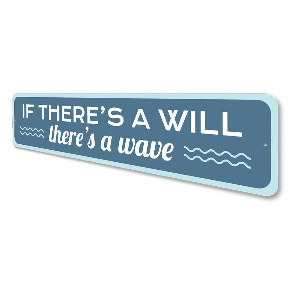 A decorative metal sign reading 'There's a Wave', featuring beach-themed design elements, perfect for coastal decor.