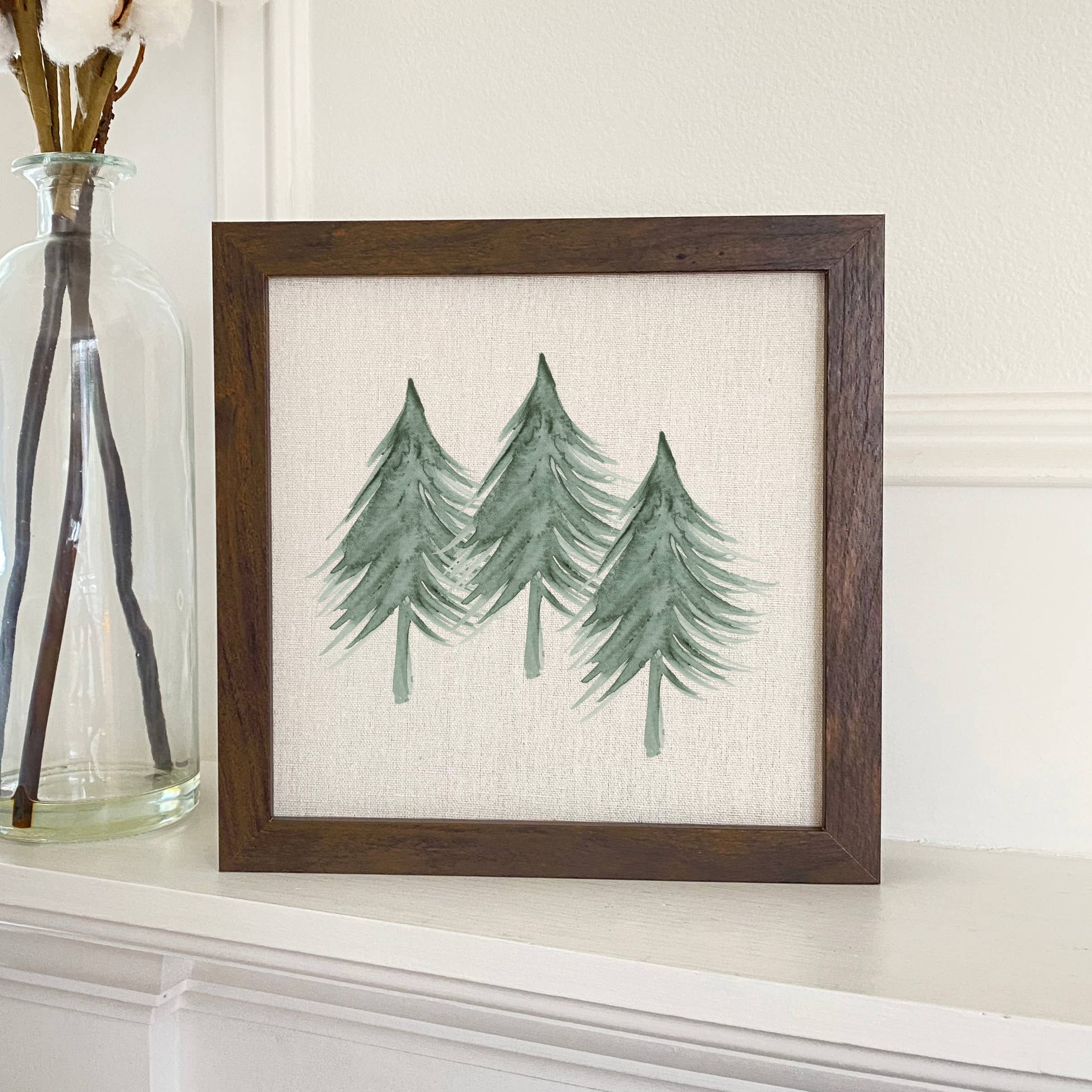 Three Trees Framed Sign with a stylized wood frame, eco-friendly ink printing on a linen-look background, available in walnut or white-washed finish.