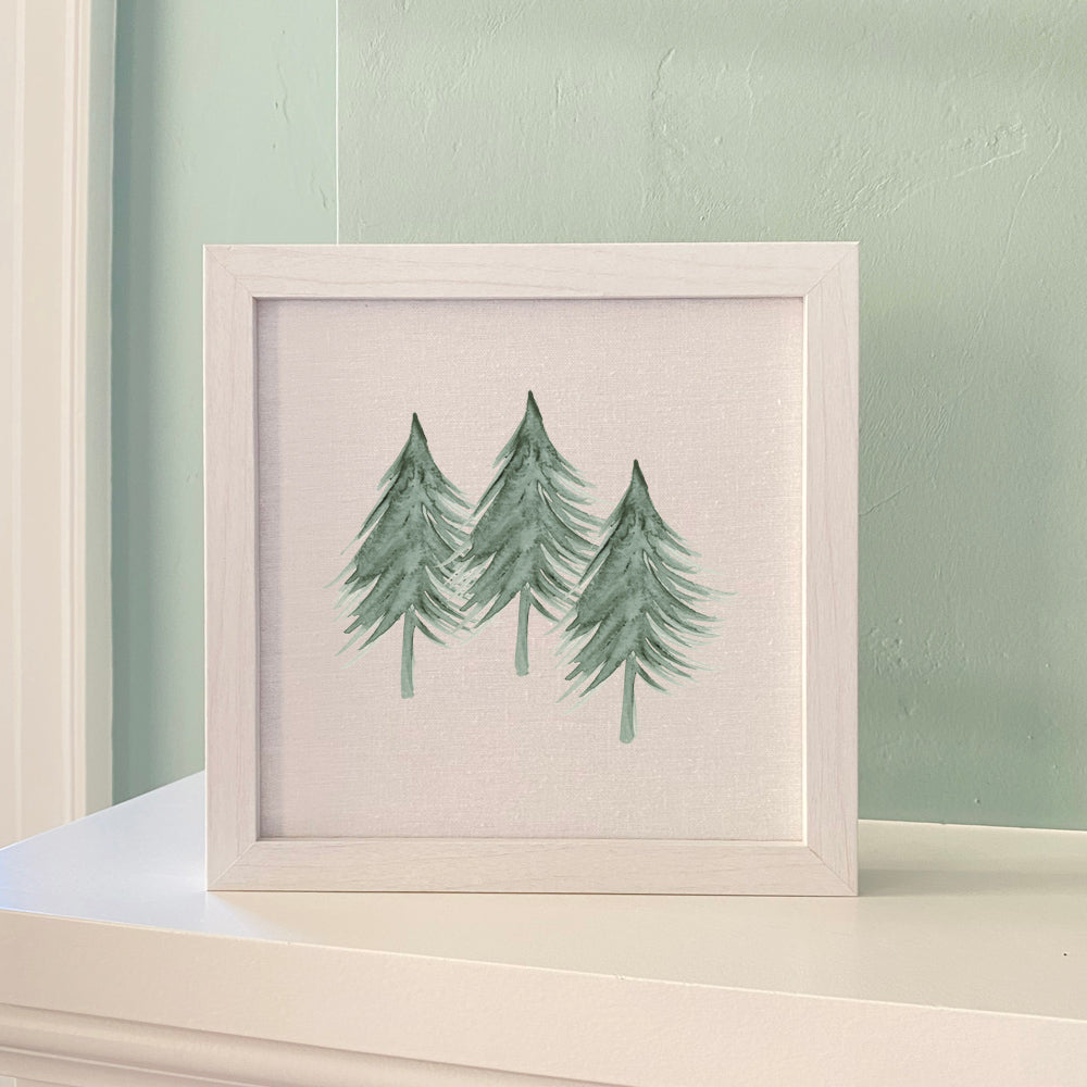 Three Trees Framed Sign with a stylized wood frame, eco-friendly ink printing on a linen-look background, available in walnut or white-washed finish.