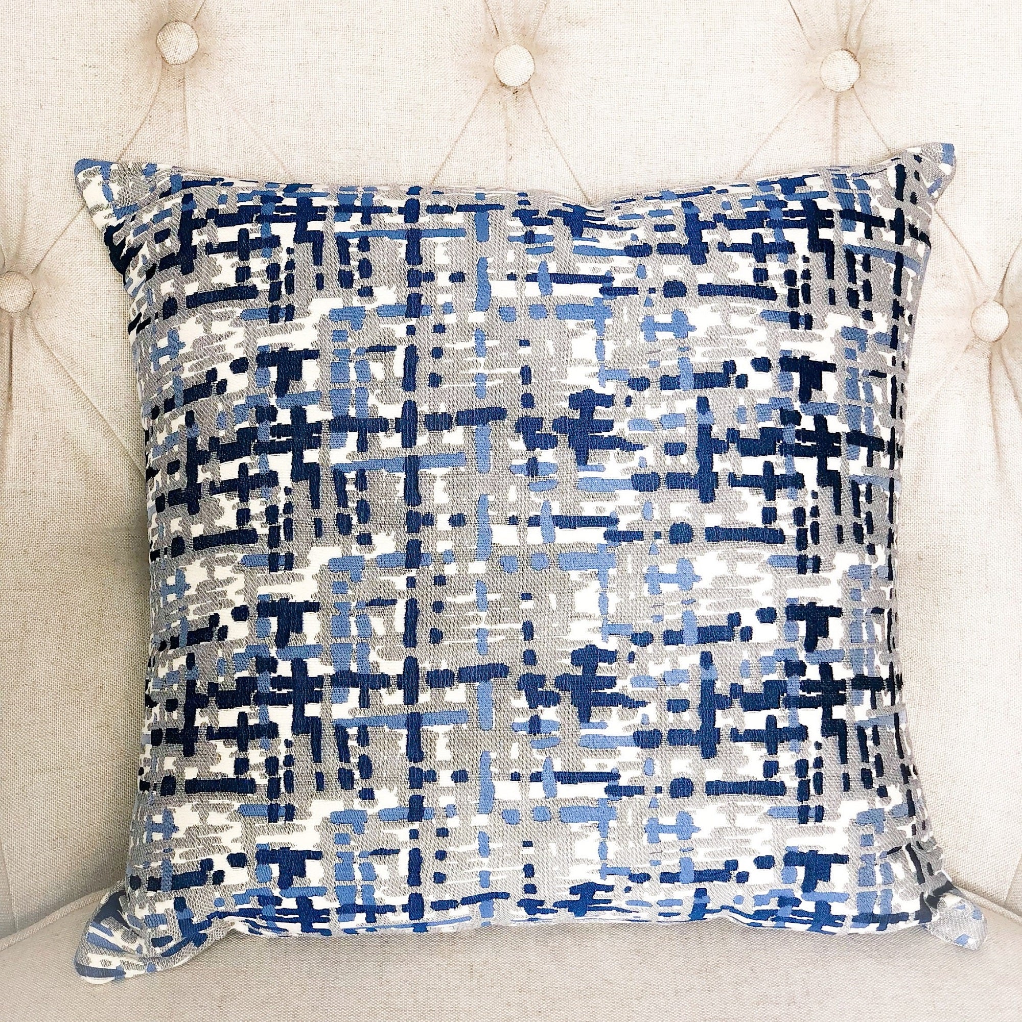 Tierra Monte Plaid Navy Blue and Gray Handmade Luxury Pillow showcasing a stylish plaid pattern with a soft texture and invisible zipper.