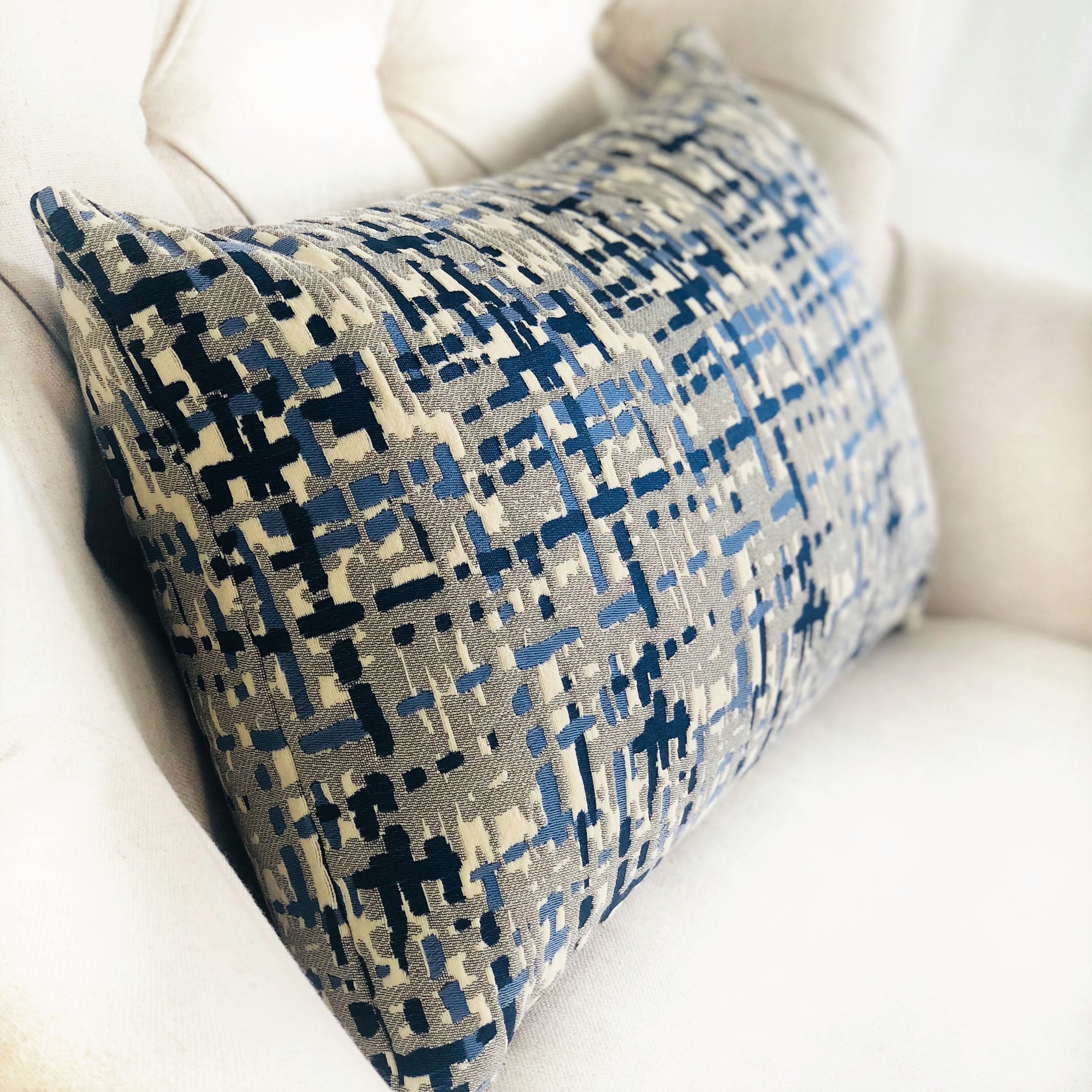 Tierra Monte Plaid Navy Blue and Gray Handmade Luxury Pillow showcasing a stylish plaid pattern with a soft texture and invisible zipper.