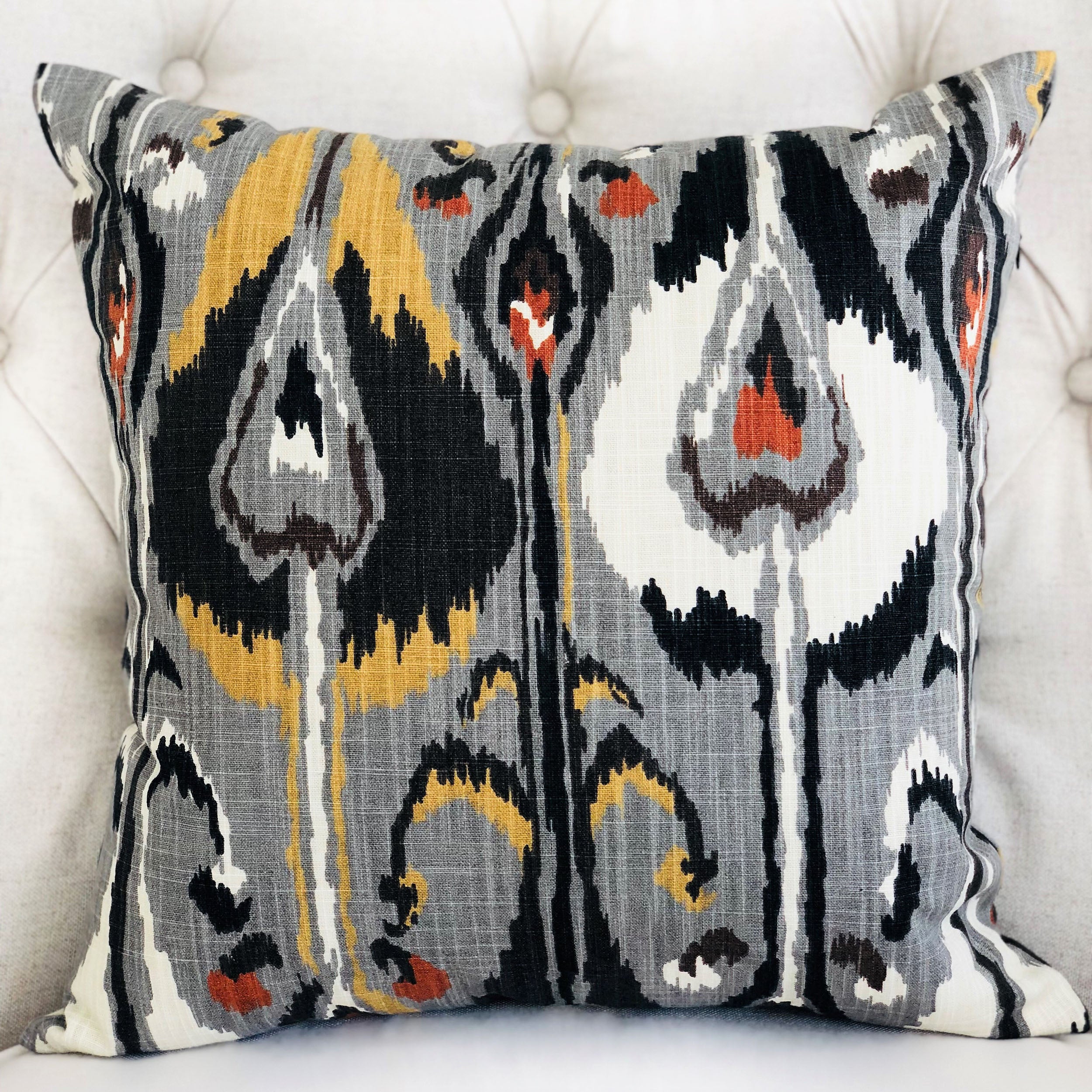 Tigerlily Gray Luxury Throw Pillow featuring a chic Ikat pattern, handmade in the USA with a soft cotton fabric and invisible zipper.