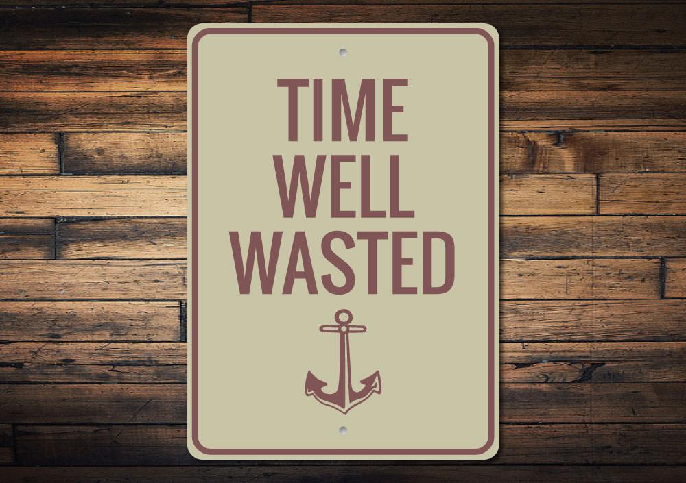 A decorative Time Well Wasted Sign made of durable aluminum, featuring a rustic design perfect for lakehouse decor.