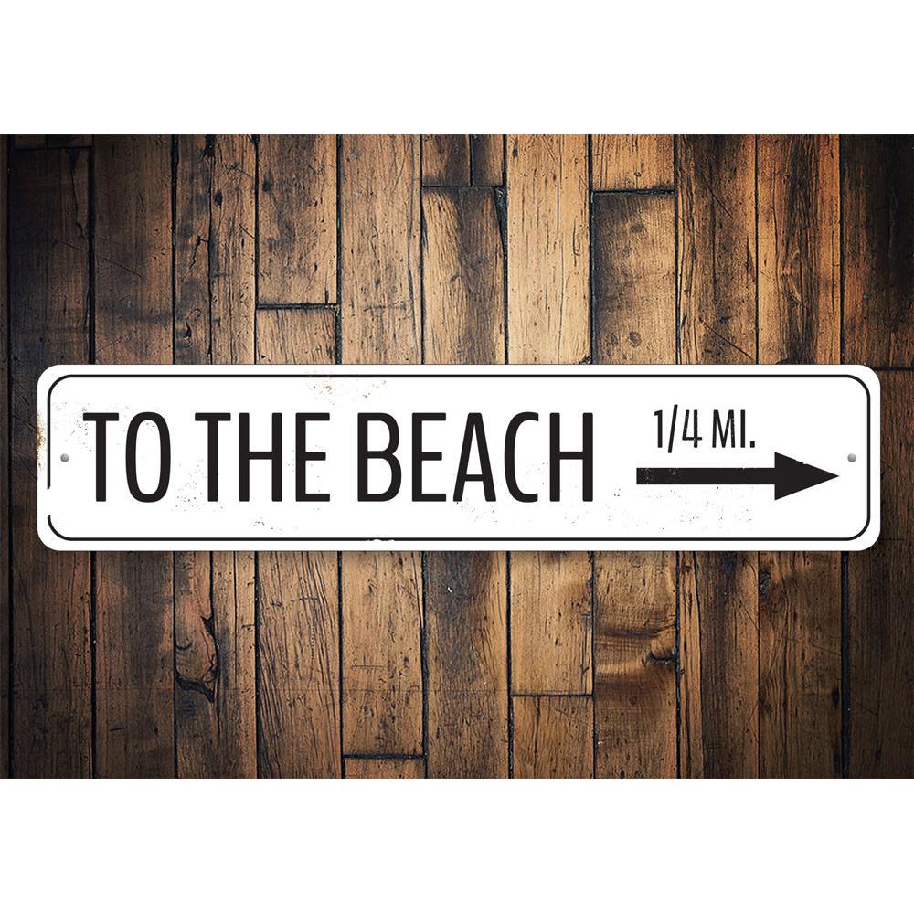 To The Beach Arrow Sign made of high-quality aluminum, featuring a vibrant design perfect for home decor.