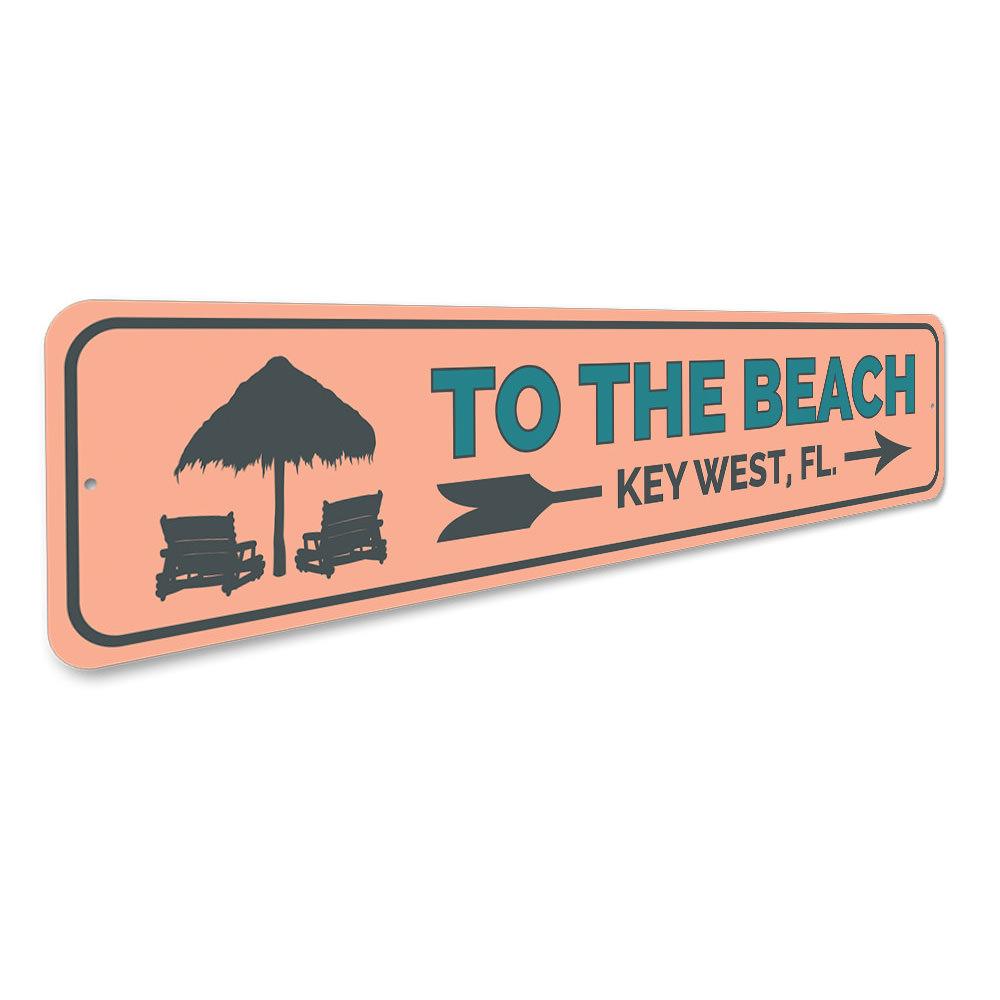 To the Beach Key West Sign made of high-quality aluminum, featuring a vibrant beach-themed design, perfect for coastal decor.