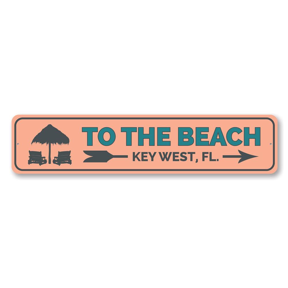 To the Beach Key West Sign made of high-quality aluminum, featuring a vibrant beach-themed design, perfect for coastal decor.