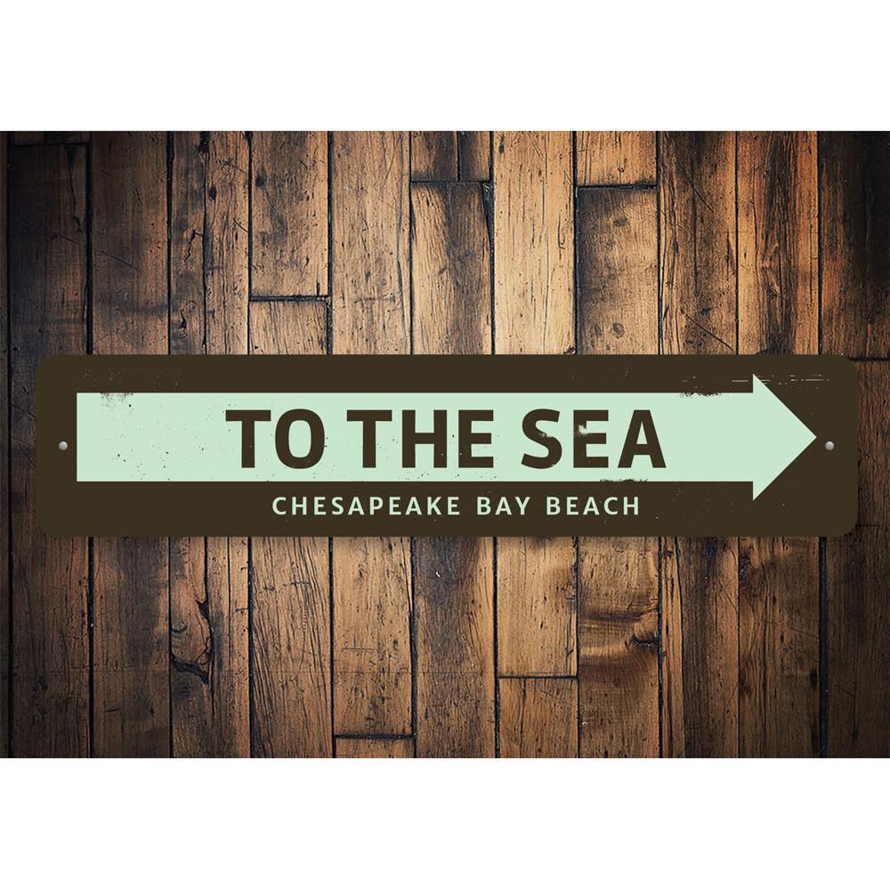 Customizable 'To the Sea' metal sign, perfect for beach-themed decor, showcasing vibrant colors and quality aluminum material.