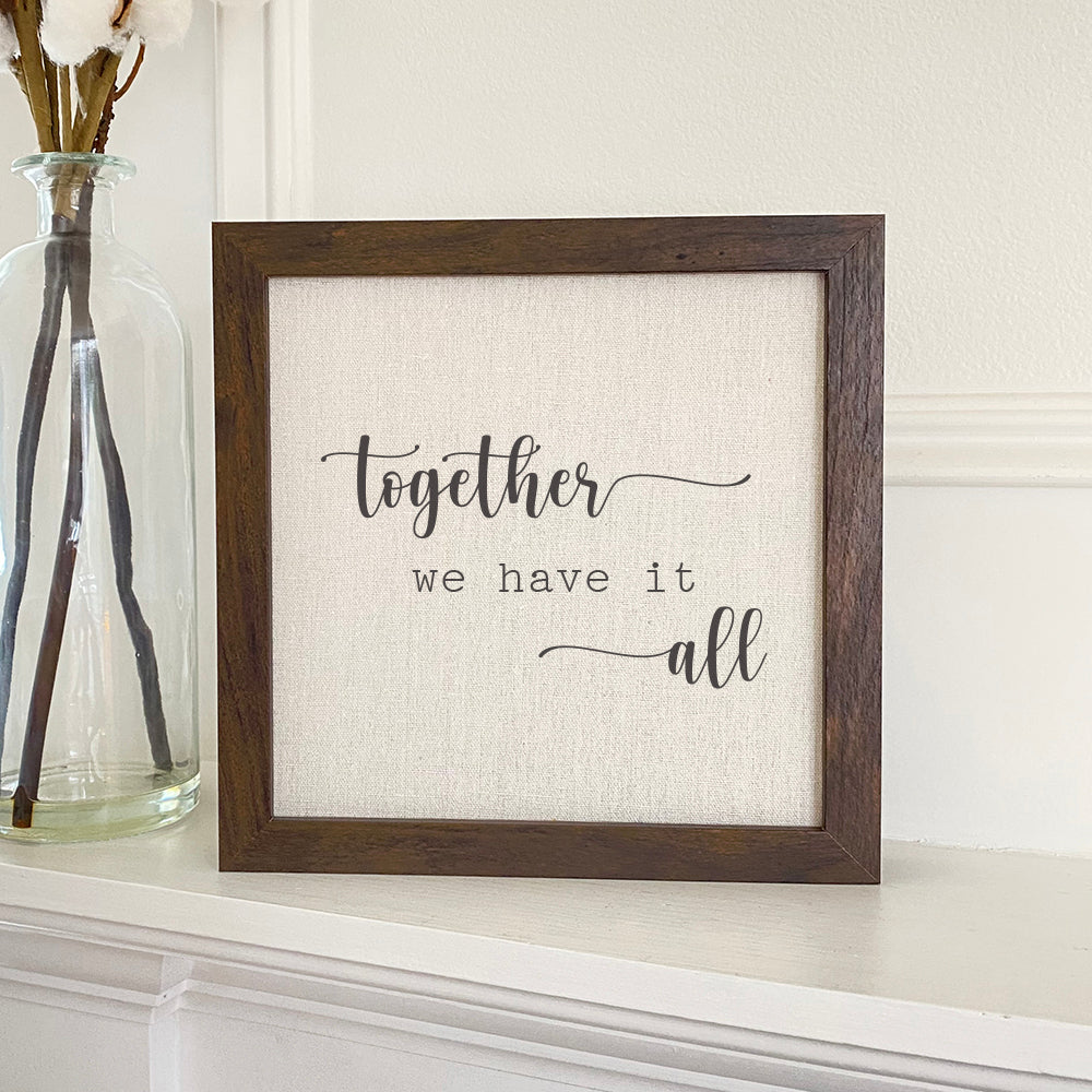 Together We Have It All framed sign with a stylized wood frame, featuring a linen-look neutral background and eco-friendly ink printing.