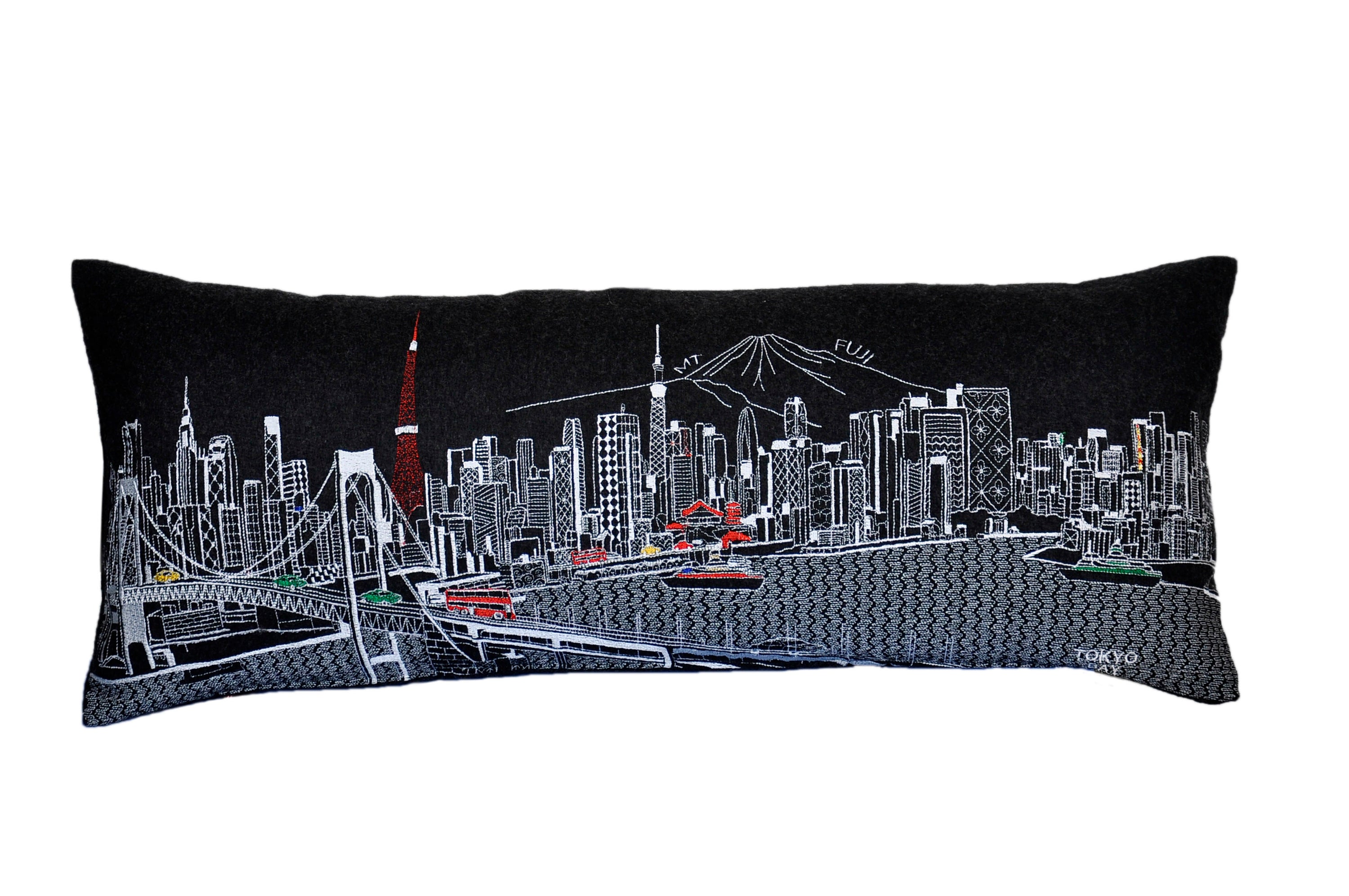 Tokyo Pillow featuring iconic landmarks like the Rainbow Bridge and Imperial Palace, designed with vibrant colors and a red zipper.