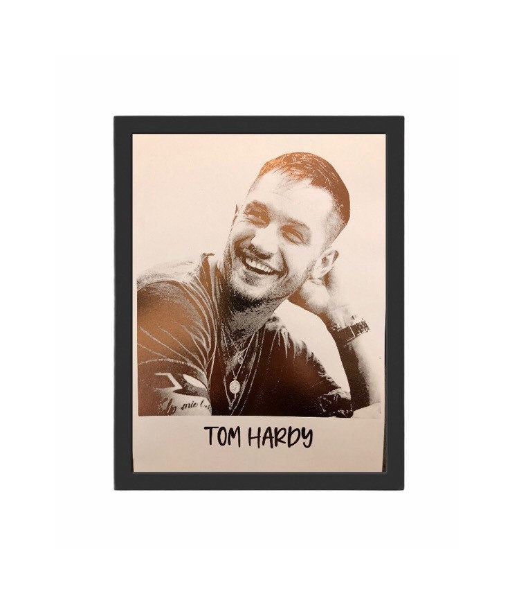 A beautiful foil print of Tom Hardy featuring a rose gold portrait on a white background.