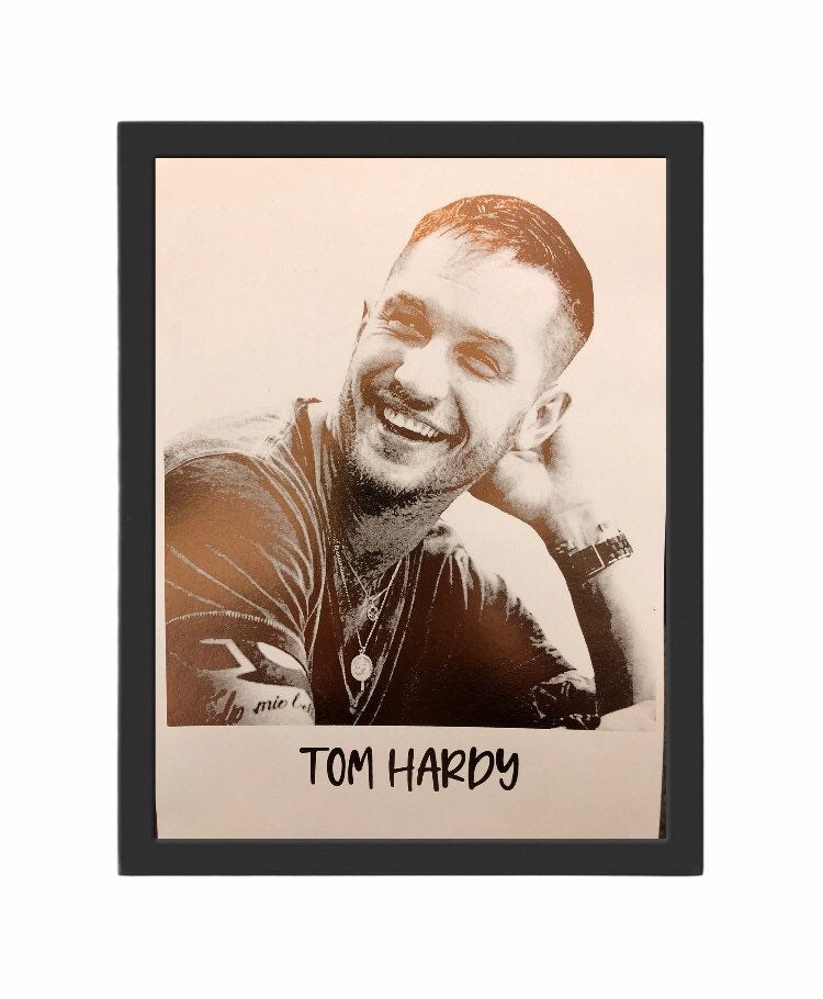 A beautiful foil print of Tom Hardy featuring a rose gold portrait on a white background.