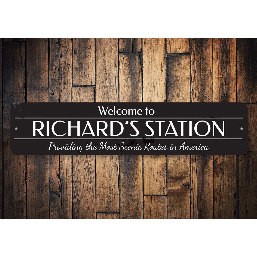 A decorative Train Station Welcome Sign made of high-quality aluminum, featuring customizable text options for a personal touch.