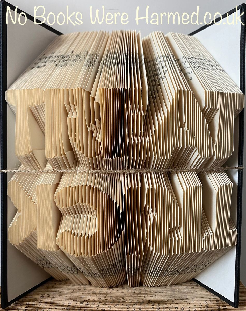 Unique TRICK TREAT book art made from hand folded vintage book pages, showcasing intricate designs and textures.