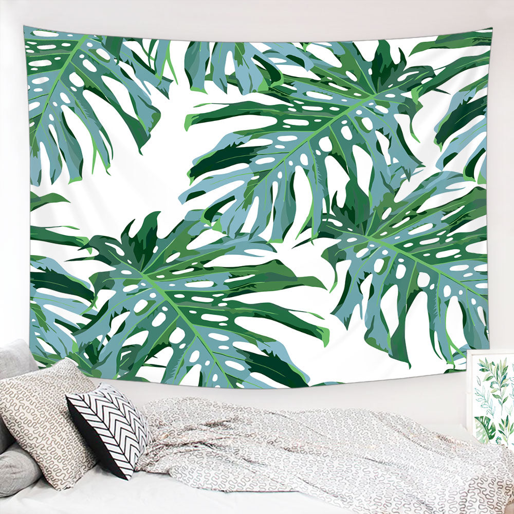 A vibrant Tropical Palm Leaf Tapestry featuring lush green palm leaves on a soft polyester fabric, perfect for boho decor.