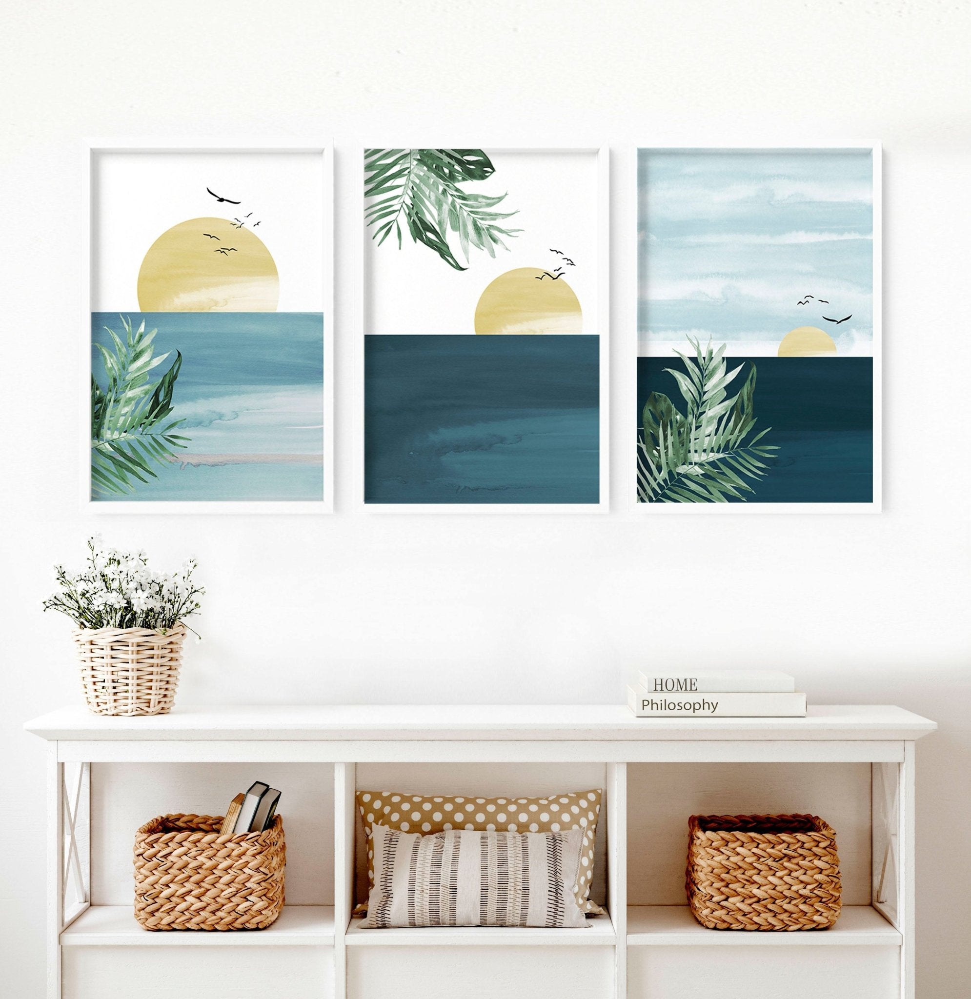 Set of 3 Tropical wall art prints featuring coastal designs in soothing blues and neutrals, perfect for home decor.