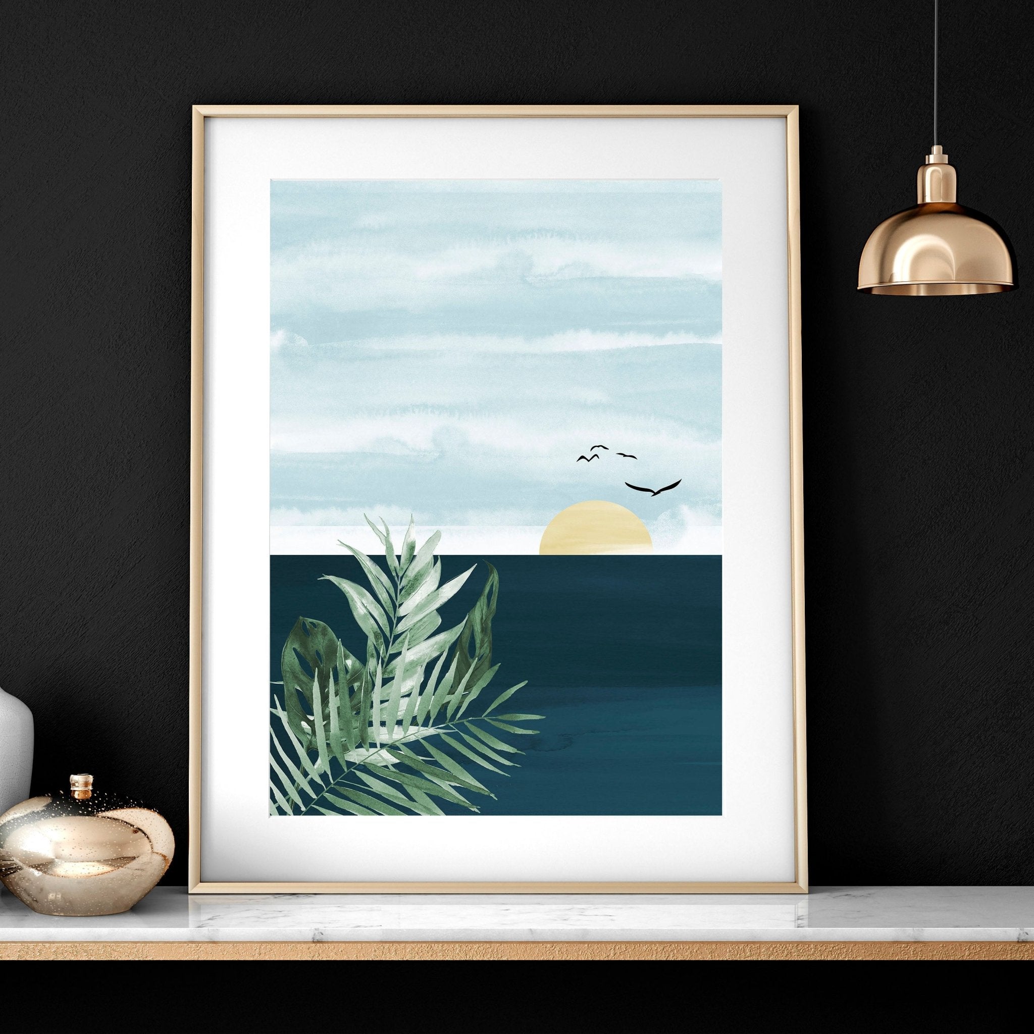 Set of 3 Tropical wall art prints featuring coastal designs in soothing blues and neutrals, perfect for home decor.