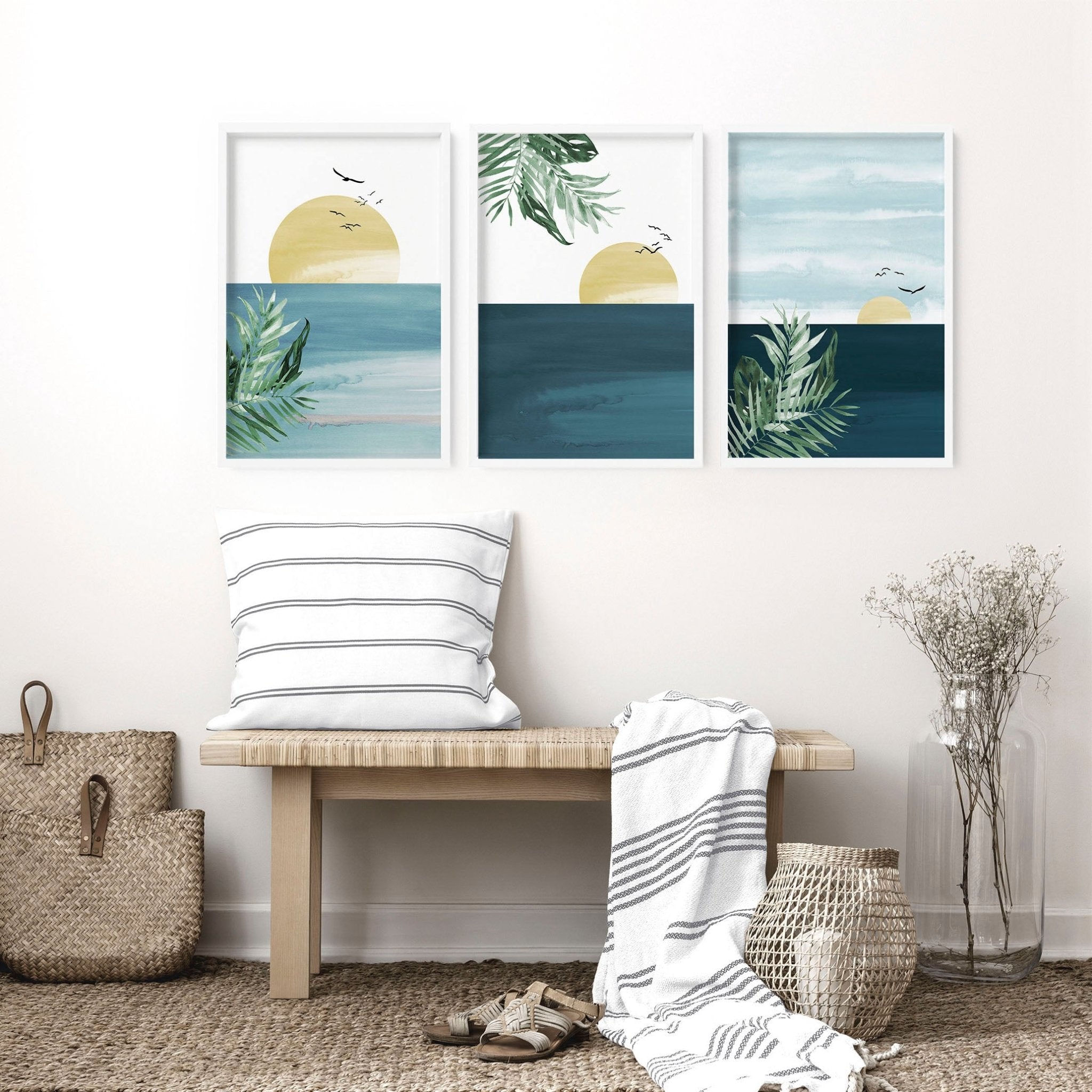 Set of 3 Tropical wall art prints featuring coastal designs in soothing blues and neutrals, perfect for home decor.