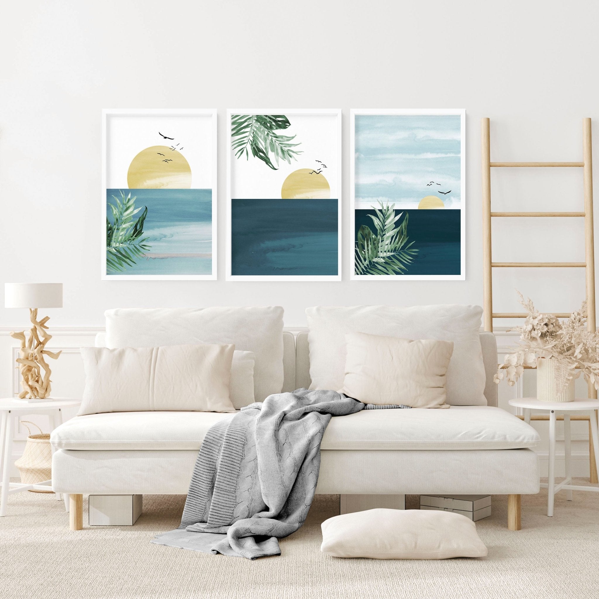 Set of 3 Tropical wall art prints featuring coastal designs in soothing blues and neutrals, perfect for home decor.