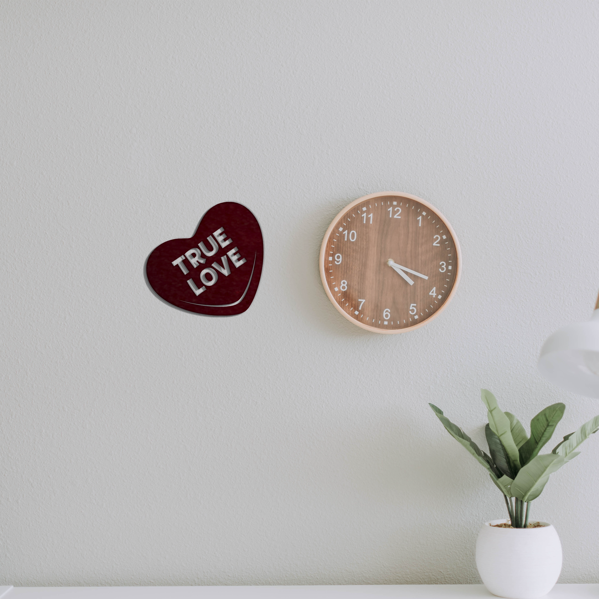 True Love Candy Heart Metal Wall Art in a vibrant red finish, showcasing a heart shape with the words 'True Love' elegantly designed.