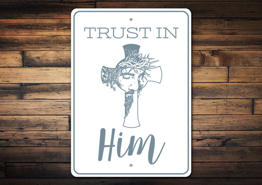 Trust in Him Sign made of high-quality aluminum, featuring inspirational text and a decorative design, perfect for home decor.