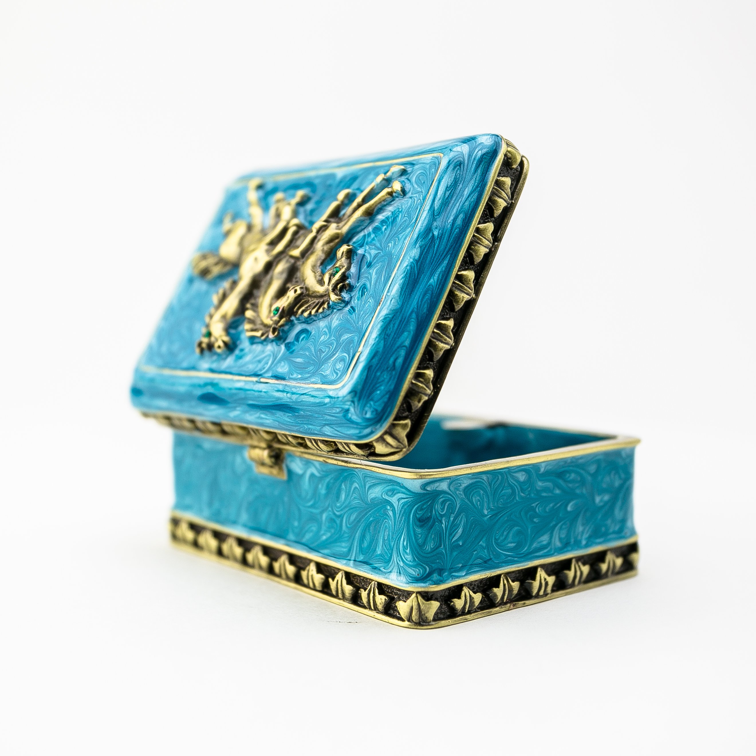 Turquoise trinket box decorated with horses and Austrian crystals, showcasing intricate enamel painting and luxurious gold or silver plating.