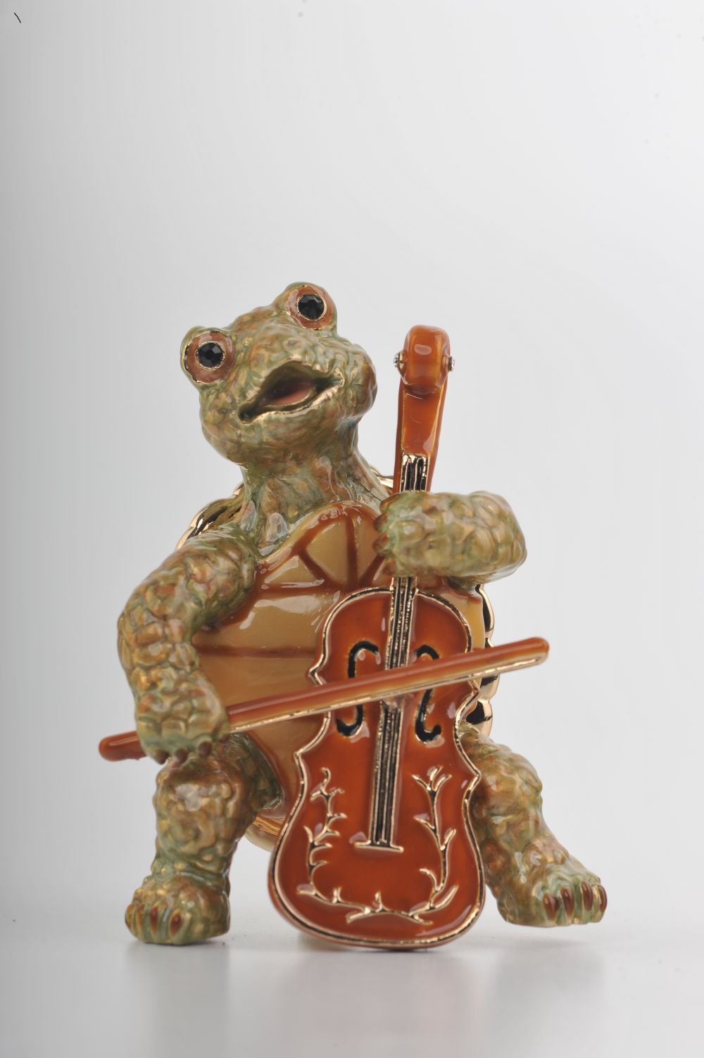 Handmade trinket box featuring a turtle playing the cello, adorned with Austrian crystals and 24K gold plating.