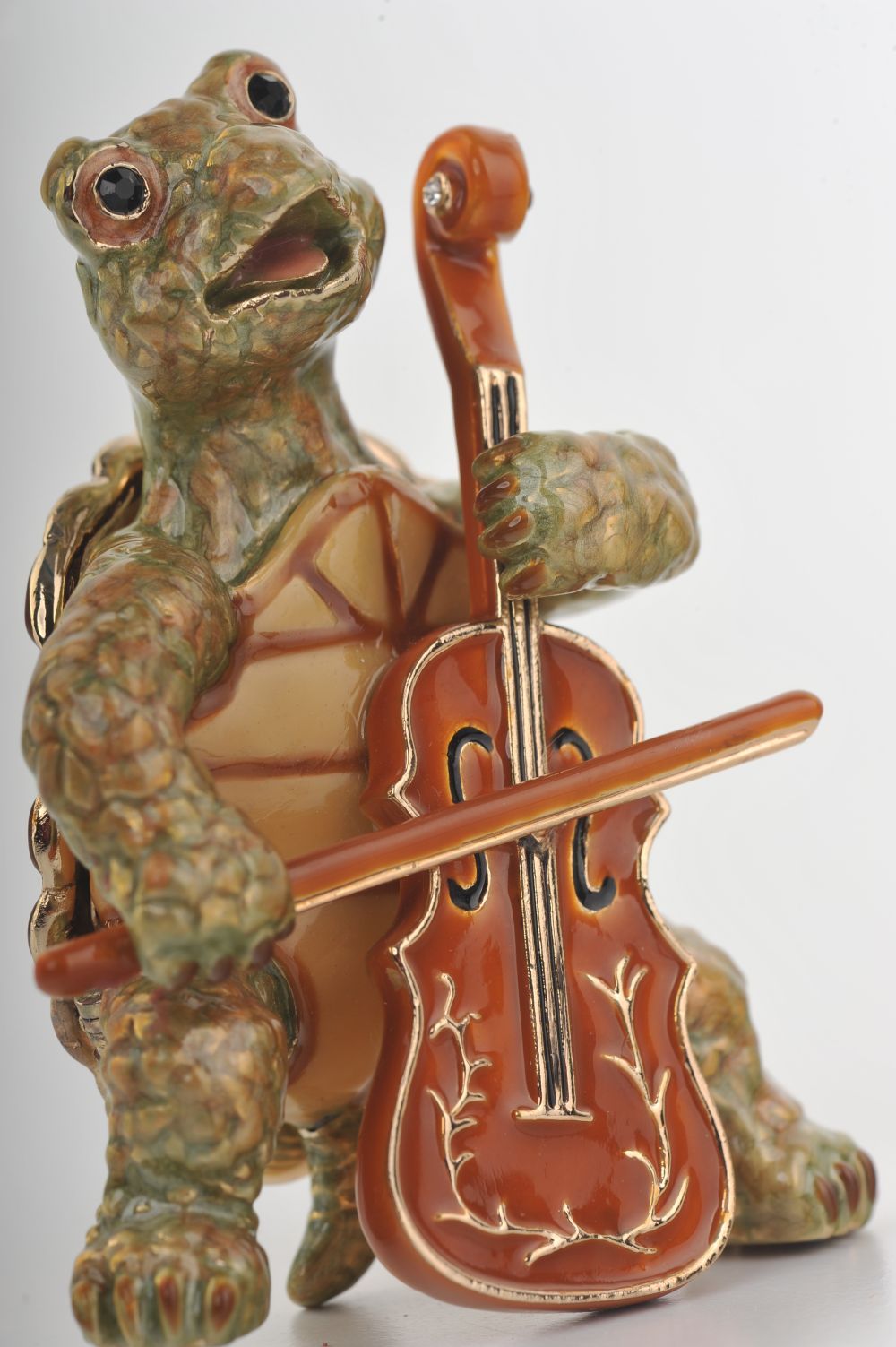 Handmade trinket box featuring a turtle playing the cello, adorned with Austrian crystals and 24K gold plating.