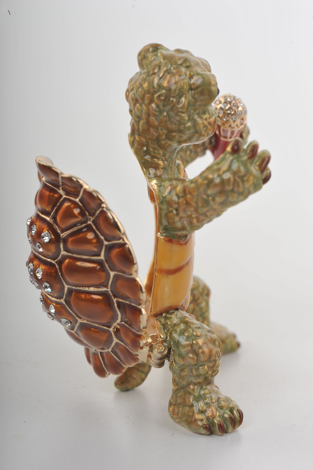 Handmade turtle trinket box playing saxophone, adorned with Austrian crystals and 24K gold plating.