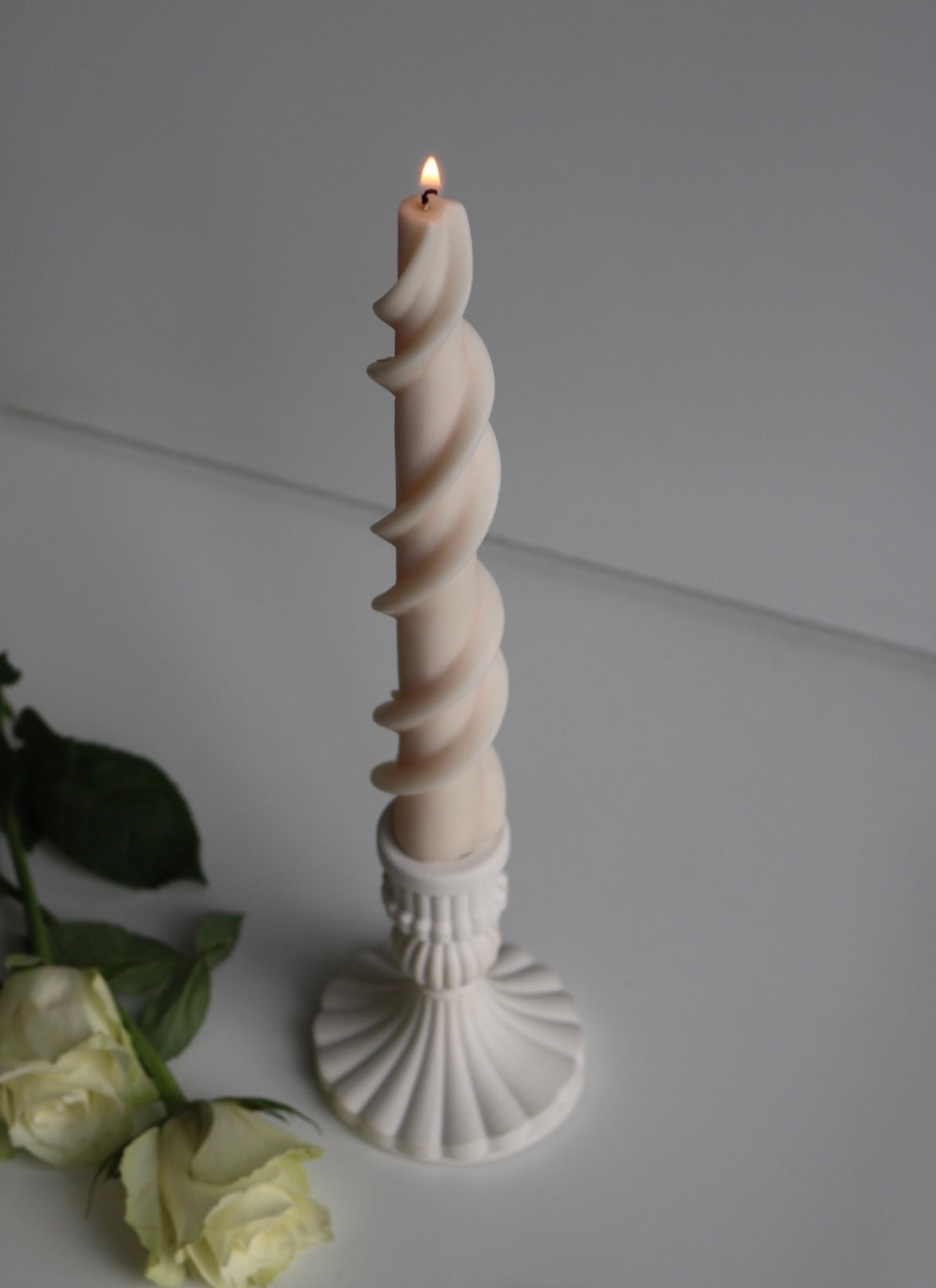 A stylish twist style candlestick made from soy wax blend, showcasing its elegant design and unscented feature.