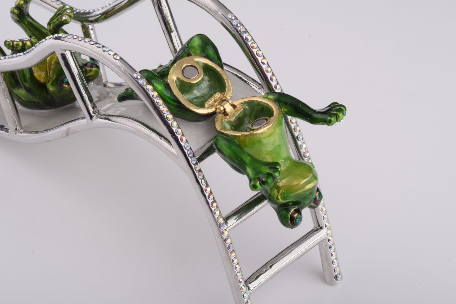 Handmade Two Frogs Riding Slide trinket box with enamel finish and Austrian crystals, plated in 24K gold.