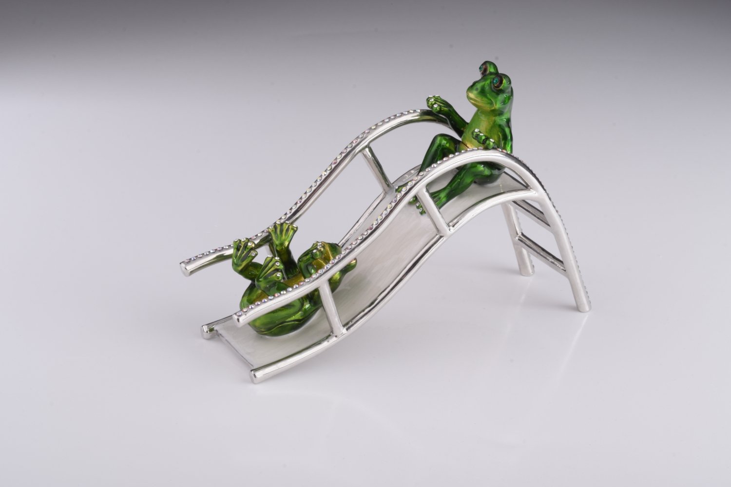 Handmade Two Frogs Riding Slide trinket box with enamel finish and Austrian crystals, plated in 24K gold.