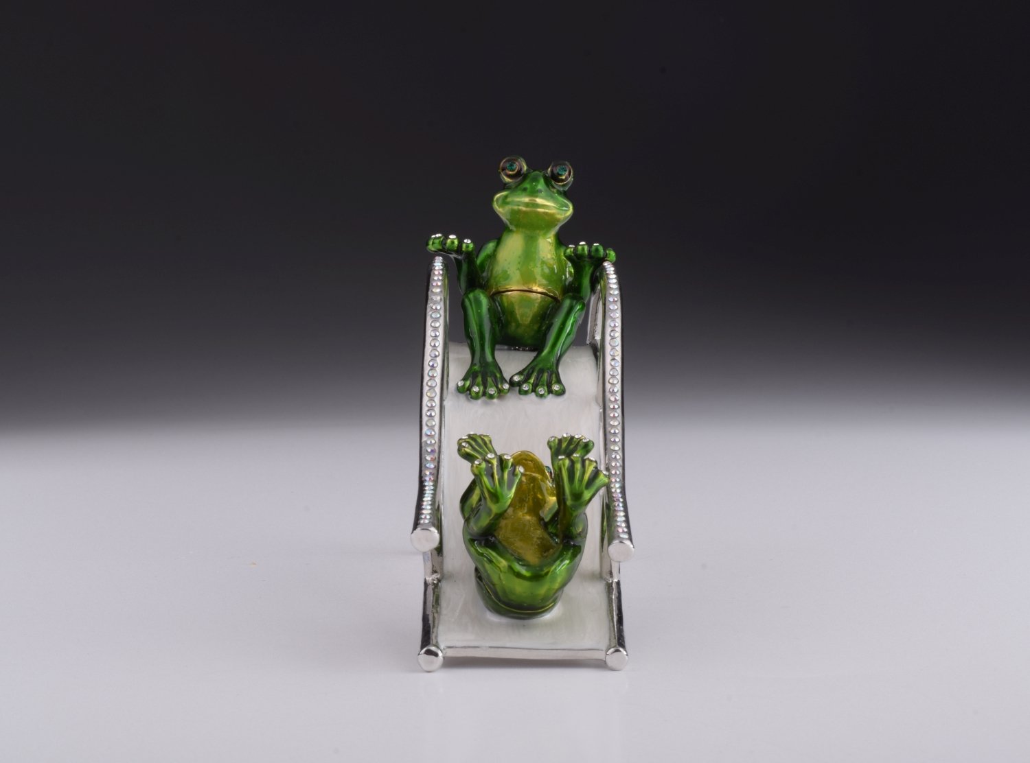 Handmade Two Frogs Riding Slide trinket box with enamel finish and Austrian crystals, plated in 24K gold.