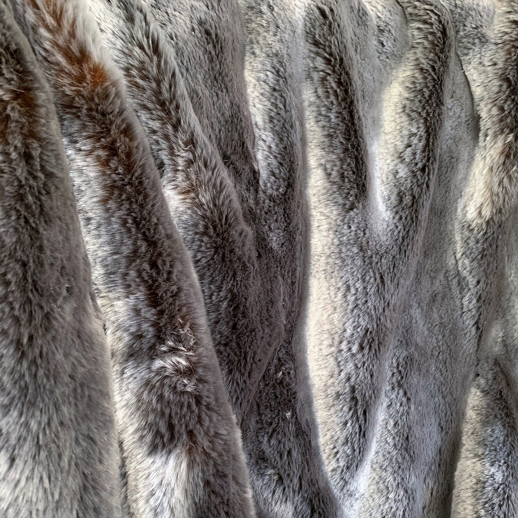 Two Tone Gray and Amber Handmade Luxury Throw showcasing plush faux fur texture and reversible design.