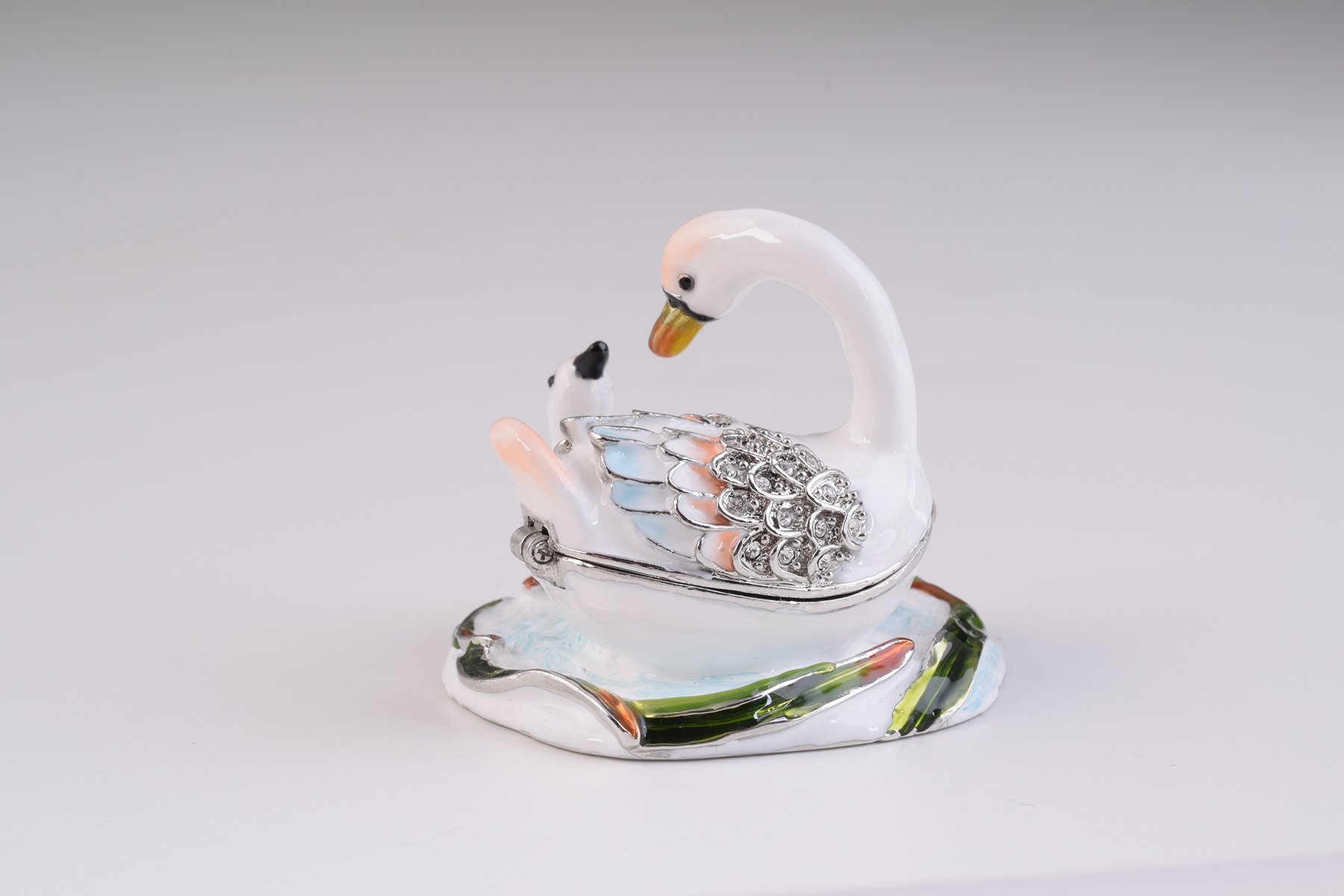 Two White Swans trinket box, handcrafted with enamel and adorned with Austrian crystals, featuring a secure magnetic closure.