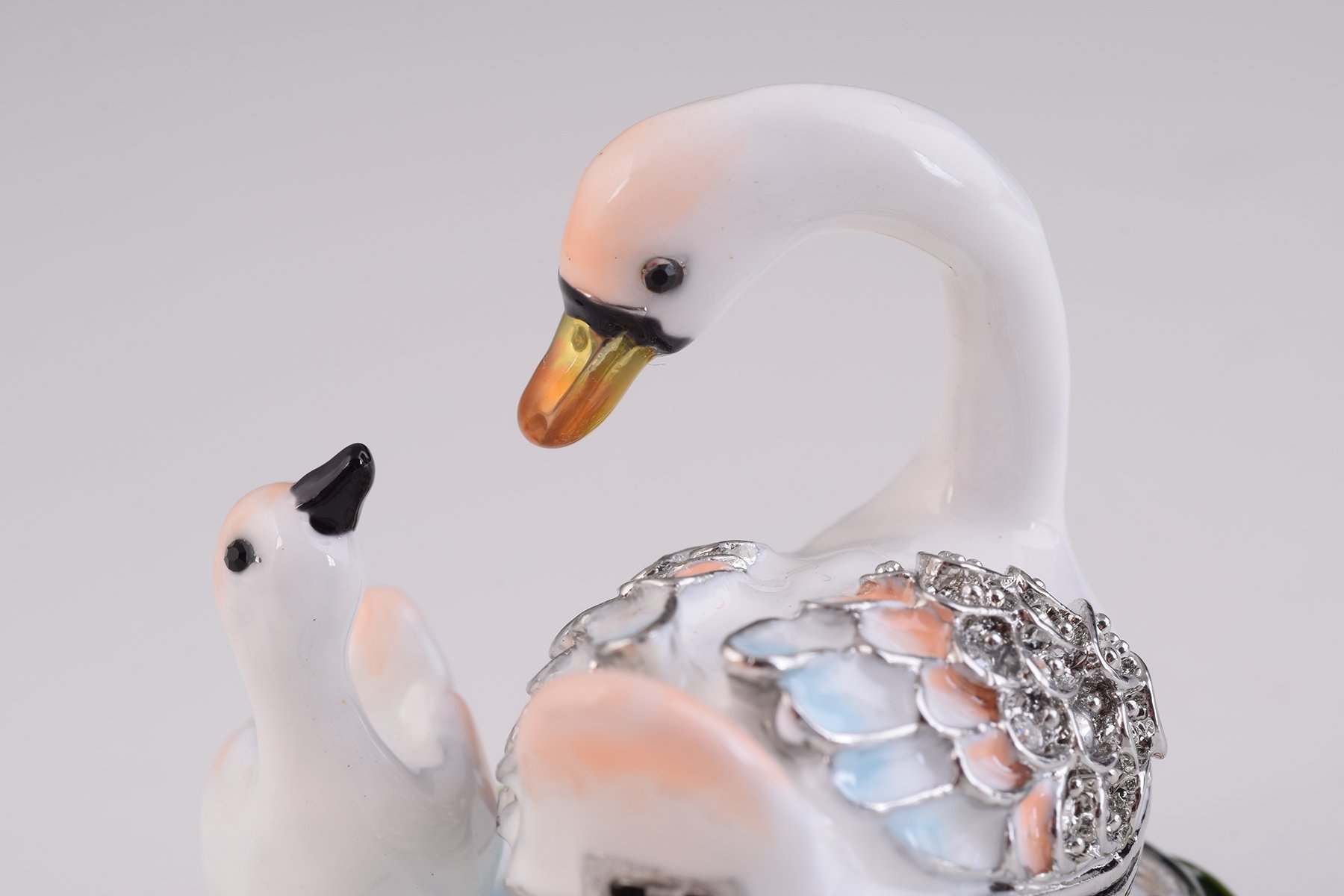 Two White Swans trinket box, handcrafted with enamel and adorned with Austrian crystals, featuring a secure magnetic closure.