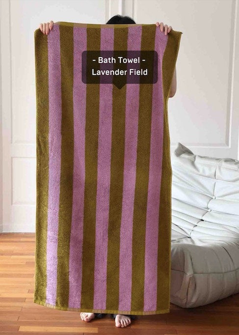 Ultra soft absorbent retro stripe bath towel made from 100% organic premium cotton, featuring vibrant colors and bold stripes.