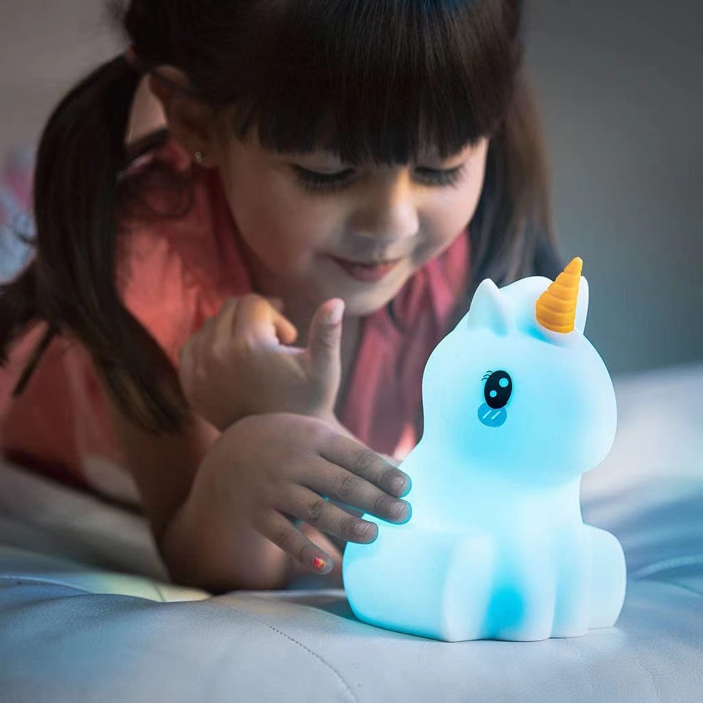 A soft silicone unicorn night light lamp in pastel colors, designed for children's nurseries, featuring a gentle glow and remote control.