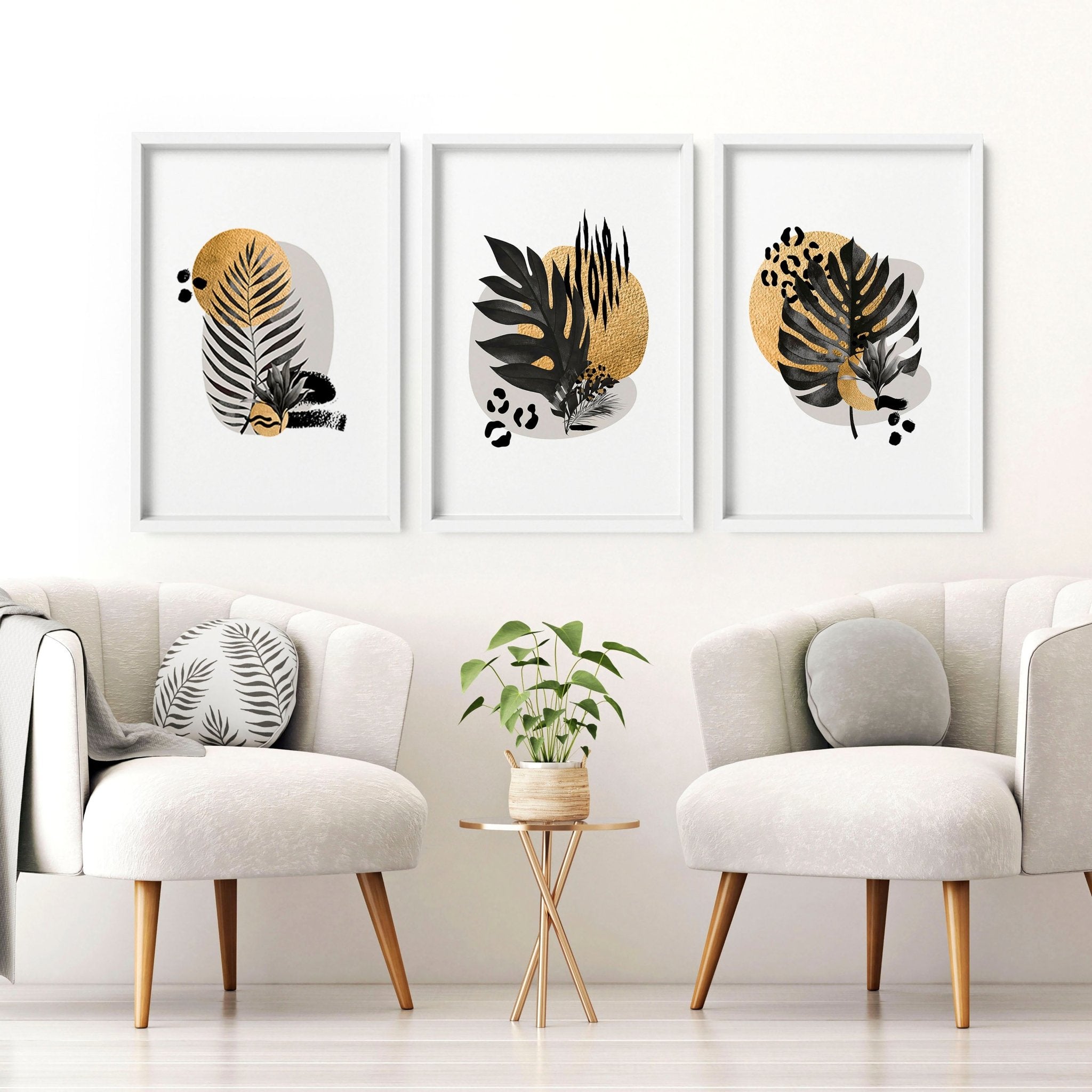 Set of 3 framed wall art prints featuring tropical botanical designs in gold, black, and grey, perfect for living room decor.