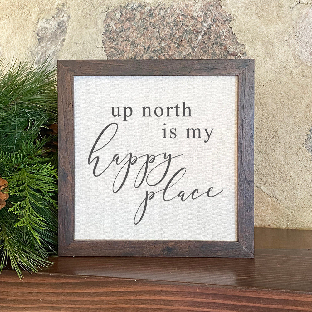 Framed sign reading 'Up North is My Happy Place' with a rustic wood frame and linen-style background, perfect for home decor.