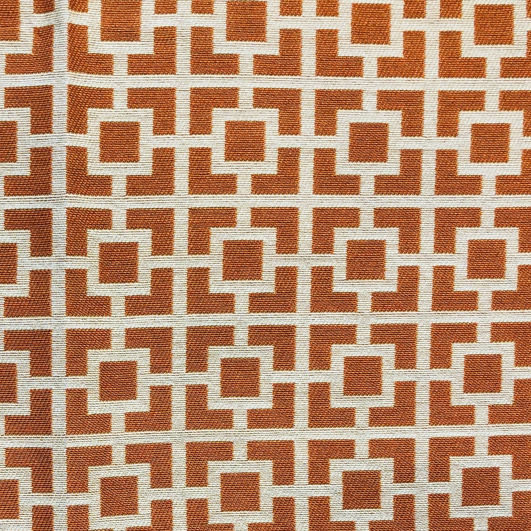 Uptown Orange and Ivory Luxury Throw Pillow featuring a geometric pattern, handmade in the USA with a soft Rayon and Polyester blend.