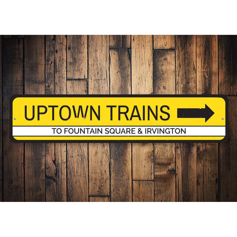 Uptown Trains Sign made of high-quality aluminum, featuring customizable text and pre-drilled holes for easy mounting.