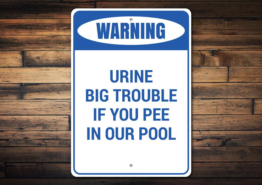 Urine Big Trouble Sign made of high-quality aluminum, featuring humorous text and a decorative design, perfect for home decor.