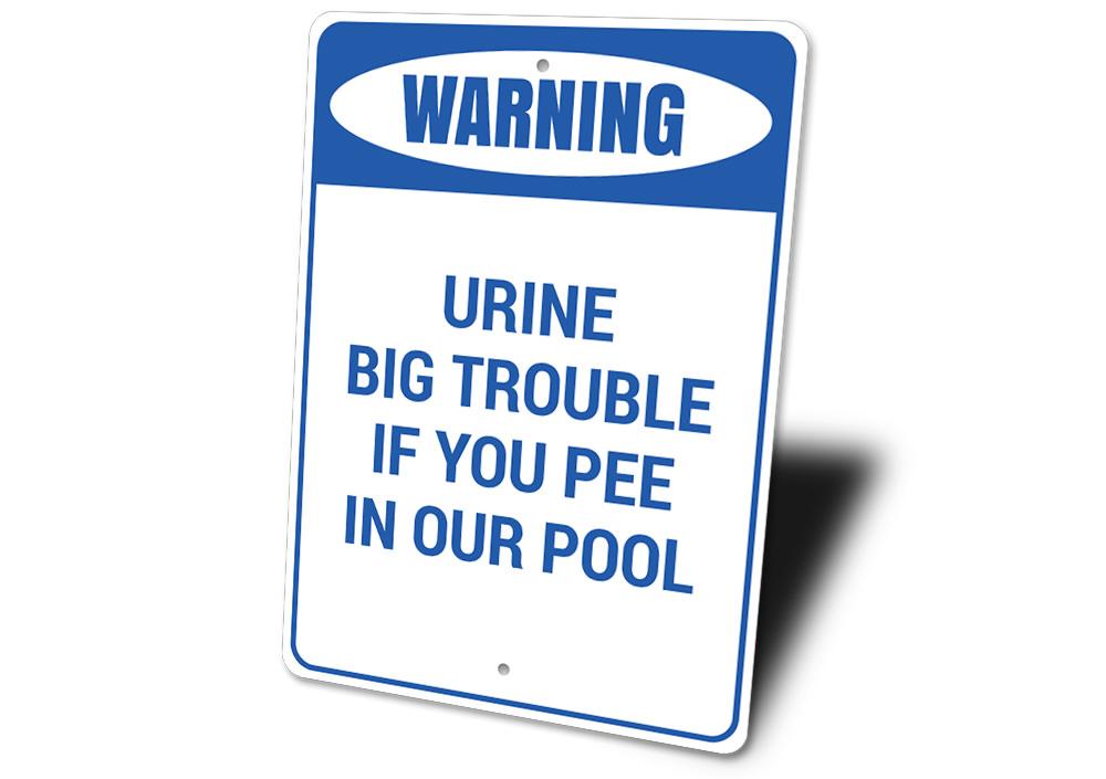 Urine Big Trouble Sign made of high-quality aluminum, featuring humorous text and a decorative design, perfect for home decor.