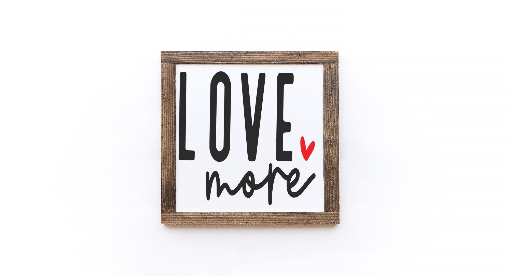 Handcrafted Valentine's Day wood sign with white background and painted lettering, showcasing unique wood grain and knots.