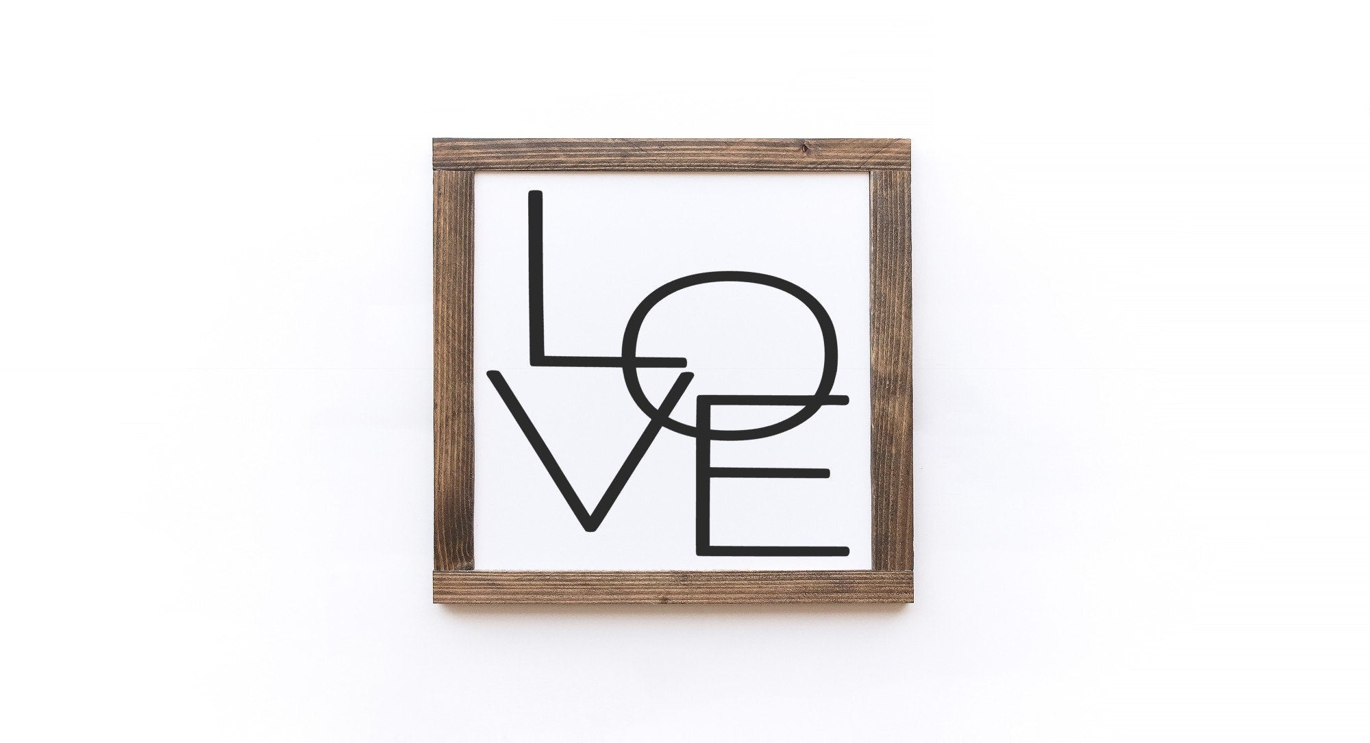 Handcrafted Valentine's Day wood sign with white background and painted lettering, showcasing unique wood grain and knots.