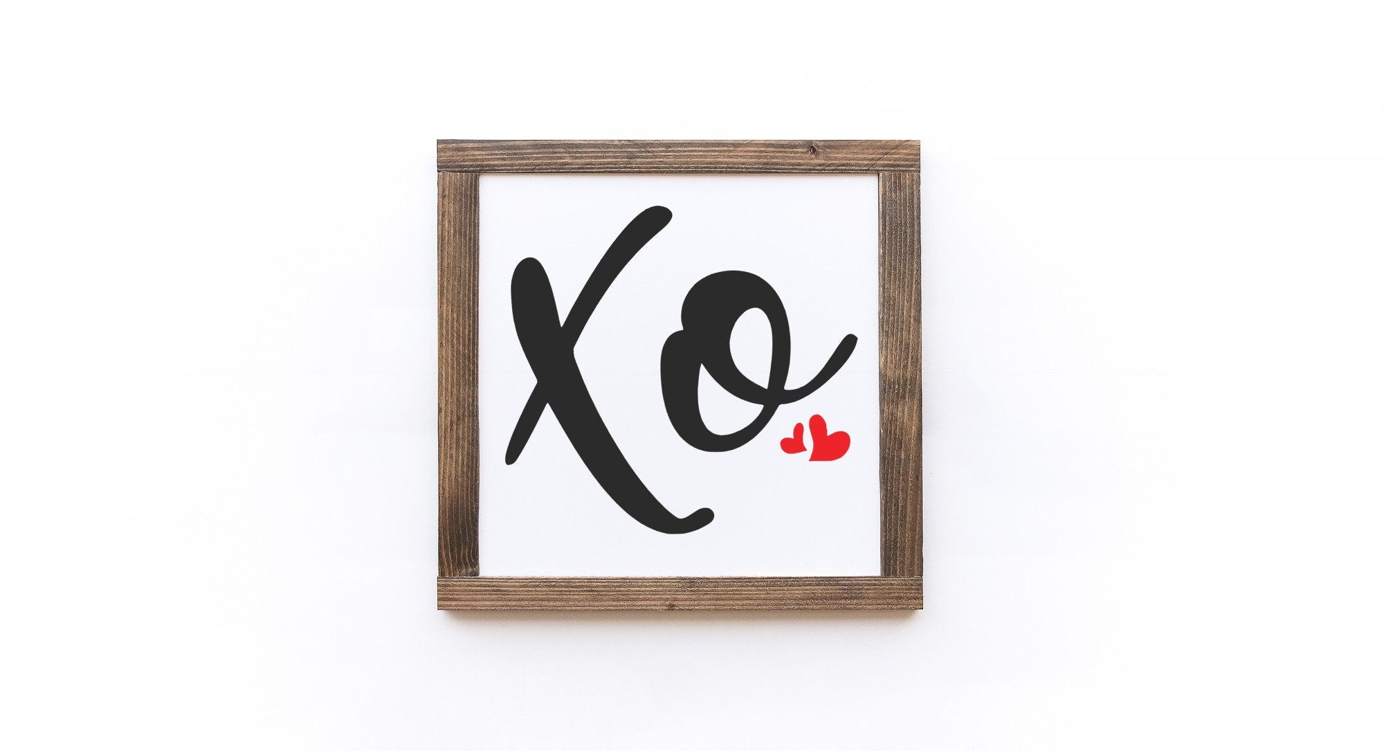 Handcrafted Valentine's Day wood sign with white background and painted lettering, showcasing unique wood grain and knots.