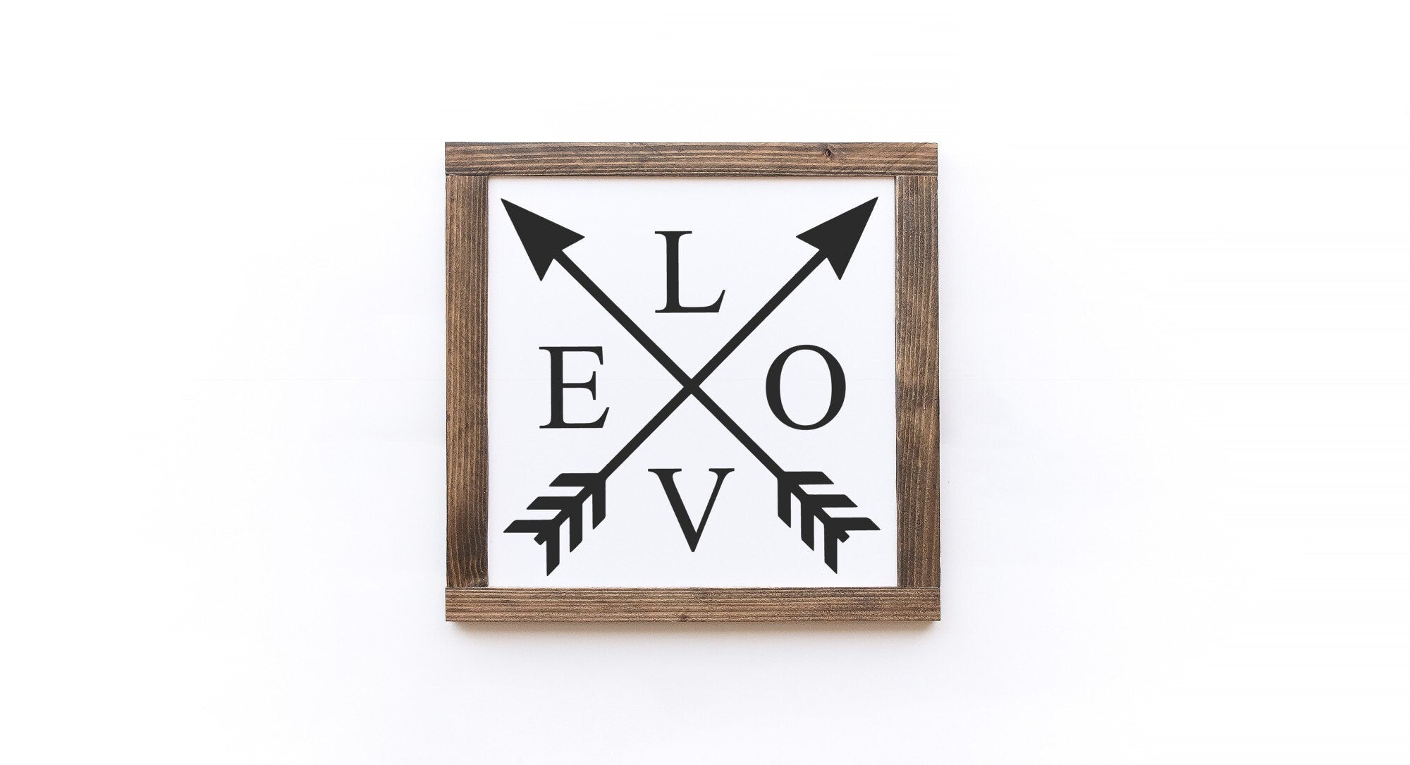 Handcrafted Valentine's Day wood sign with white background and painted lettering, showcasing unique wood grain and knots.