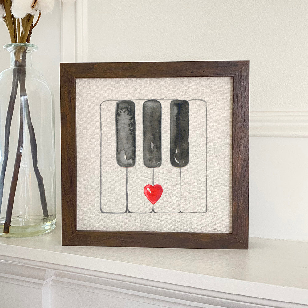 A beautifully framed Valentine's Piano Keys sign with a linen-look background, available in walnut or white-washed frame.