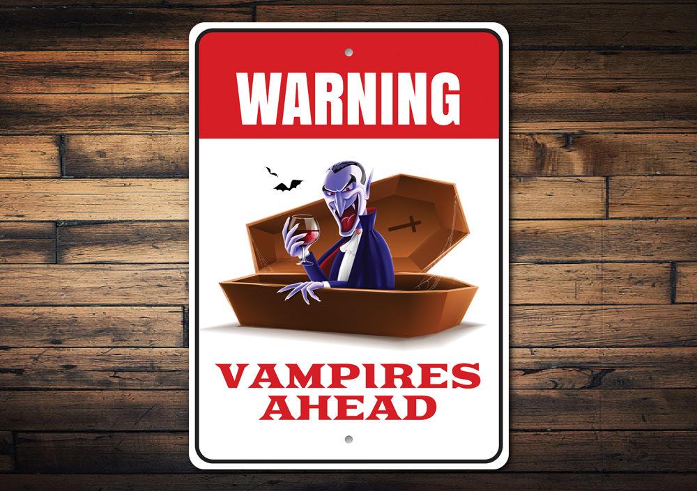 A spooky Vampire Warning Sign made of durable aluminum, featuring eerie graphics perfect for Halloween decor.